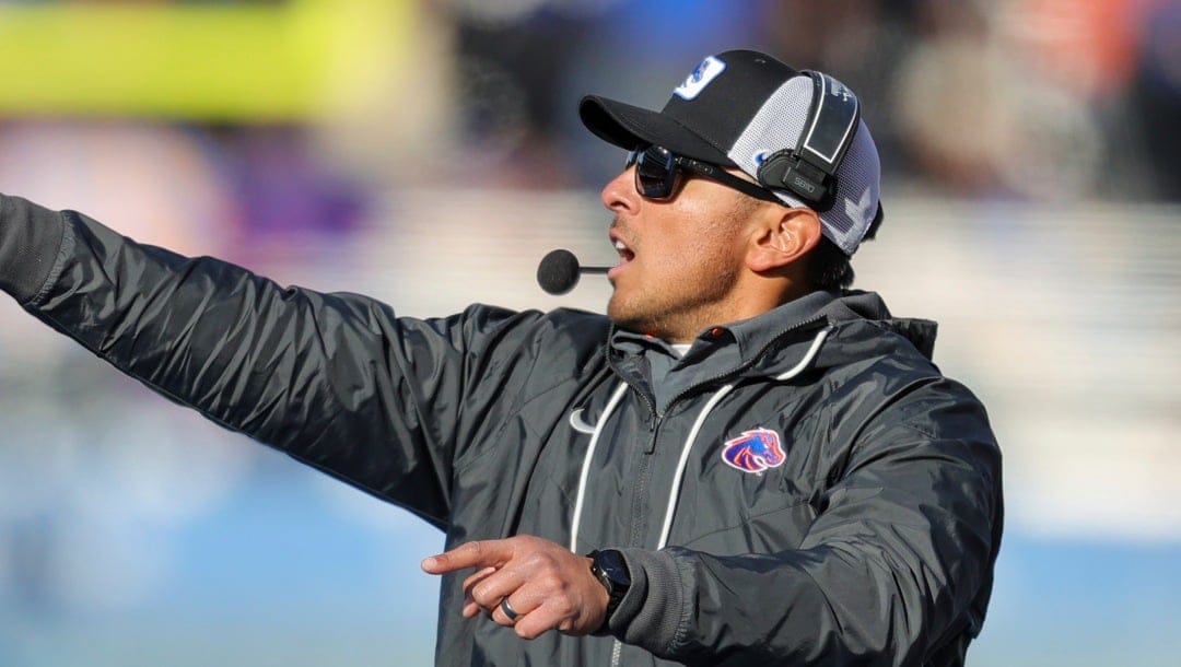 Boise State head coach Andy Avalos calls out defensive adjustments in the second half of an NCAA college football game against Utah State, Friday, Nov. 25, 2022, in Boise, Idaho. Boise State won 42-23. (AP Photo/Steve Conner)