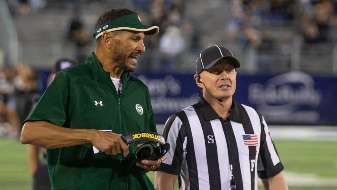 Colorado State head coach Jay Norvell talks to an official on the sidelines against Nevada in the first half of an NCAA college football game in Reno, Nev., Friday, Oct. 7, 2022. (AP Photo/Tom R. Smedes)