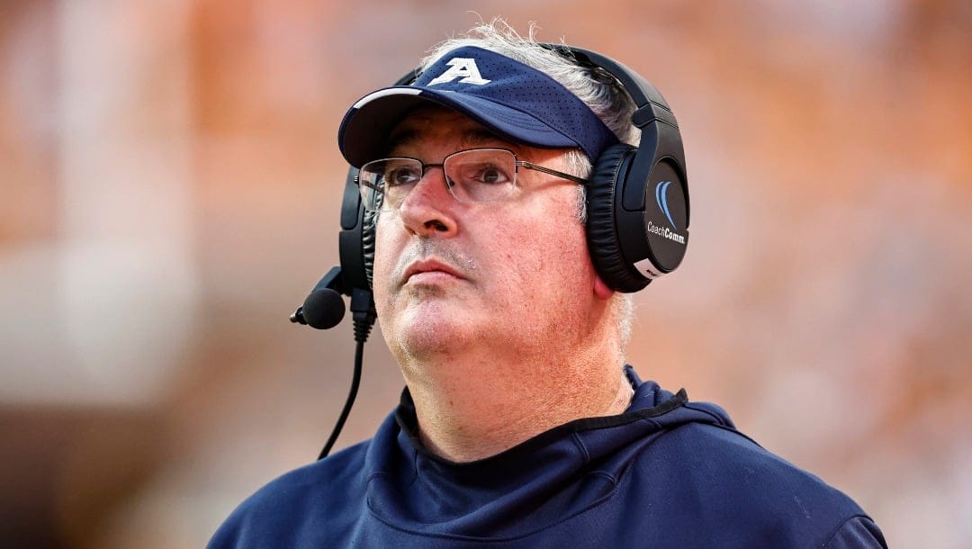 Akron head coach Joe Moorhead watches play on the Jumbotron during the first half of an NCAA college football game against Tennessee, Saturday, Sept. 17, 2022, in Knoxville, Tenn. (AP Photo/Wade Payne)