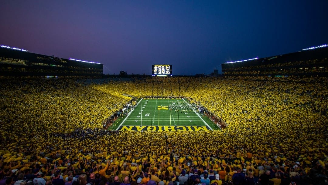 The Michigan Marching Band takes the field to a “maize out” crowd at Michigan Stadium before an NCAA college football game against Washington in Ann Arbor, Mich., Saturday, Sept. 11, 2021. Michigan won 31-10. (AP Photo/Tony Ding)