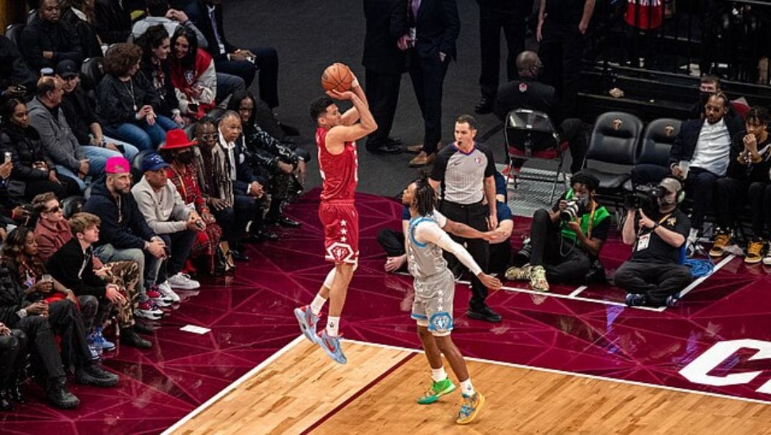 Devin Booker of the Phoenix Suns shoots of Cleveland Cavaliers’ Darius Garland during the 2022 NBA All-Star Game.