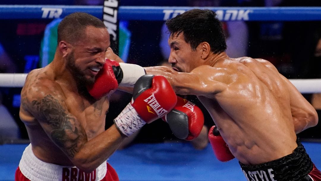 Janibek Alimkhanuly, of Kazakhstan, hits Rob Brant during a middleweight boxing match Saturday, June 26, 2021, in Las Vegas.