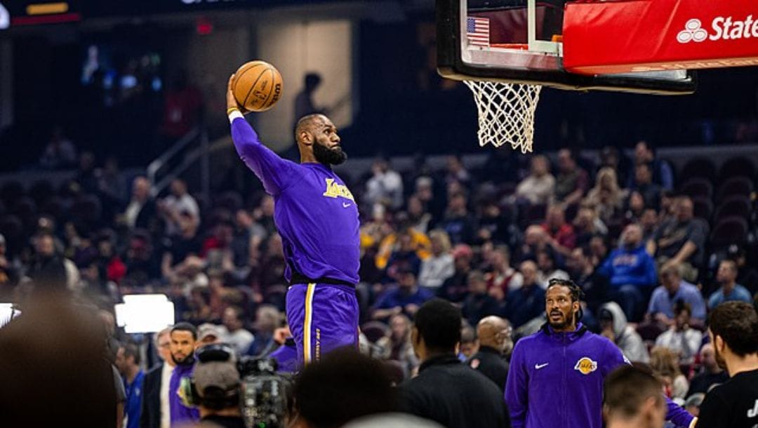 LeBron James of the Los Angeles Lakers dunking during the pregame warmups in a game versus the Cleveland Cavaliers.