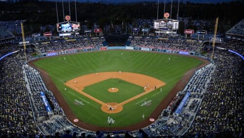 Fans watch at the Los Angeles Dodgers play the Arizona Diamondbacks in the first inning of an opening day baseball game in Los Angeles.