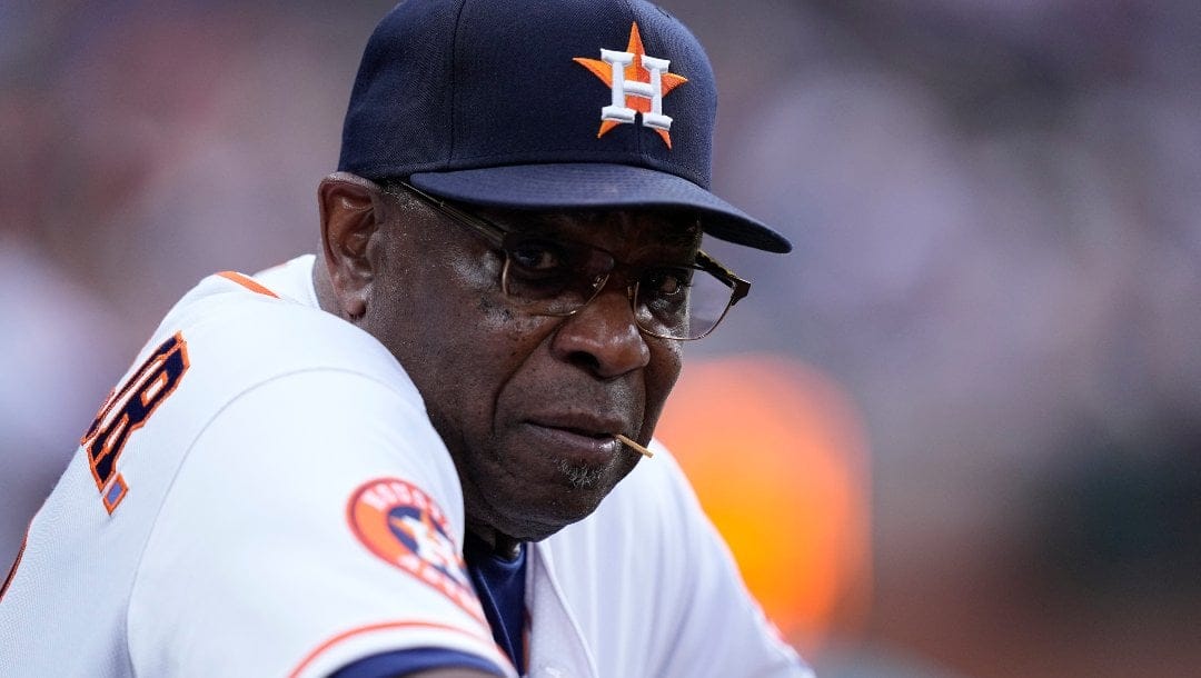 Houston Astros manager Dusty Baker Jr. watches from the top step during the third inning of a baseball game against the San Francisco Giants, Tuesday, May 2, 2023, in Houston.