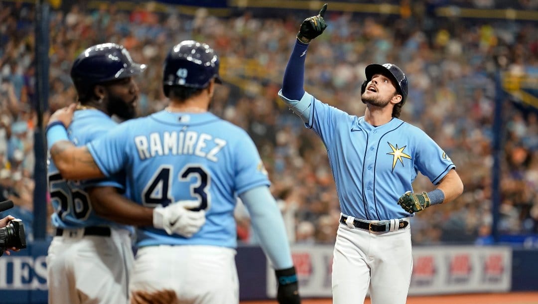 Tampa Bay Rays' Josh Lowe, right, celebrates his three-run home run off Milwaukee Brewers starting pitcher Freddy Peralta during the fourth inning of a baseball game Sunday, May 21, 2023, in St. Petersburg, Fla.