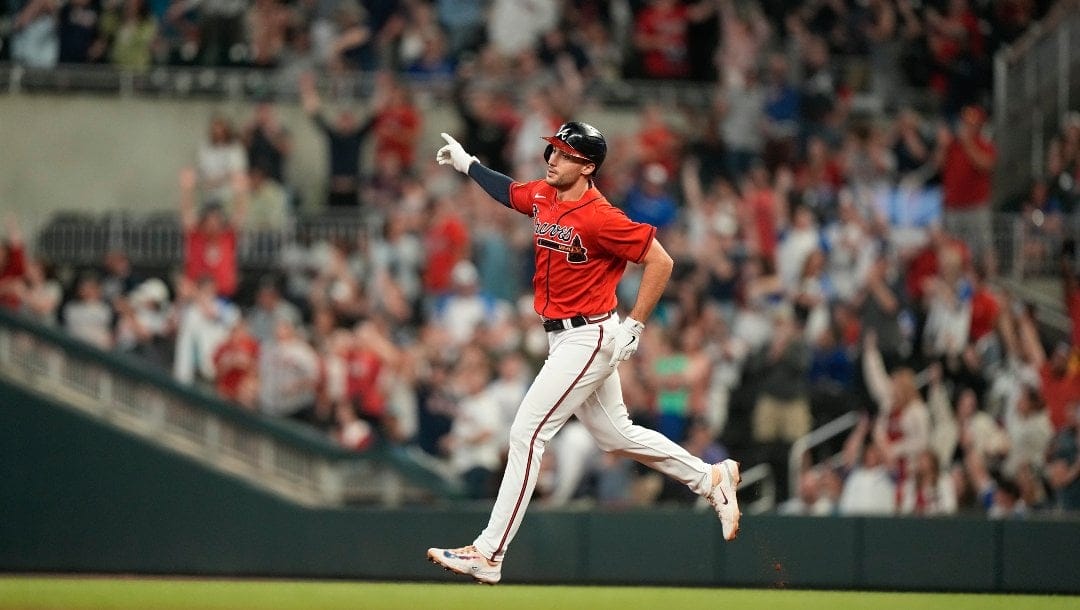 Atlanta Braves' Matt Olson celebrates while running the bases on his home run during the eighth inning of the team's baseball game against the Seattle Mariners, Friday, May 19, 2023, in Atlanta.