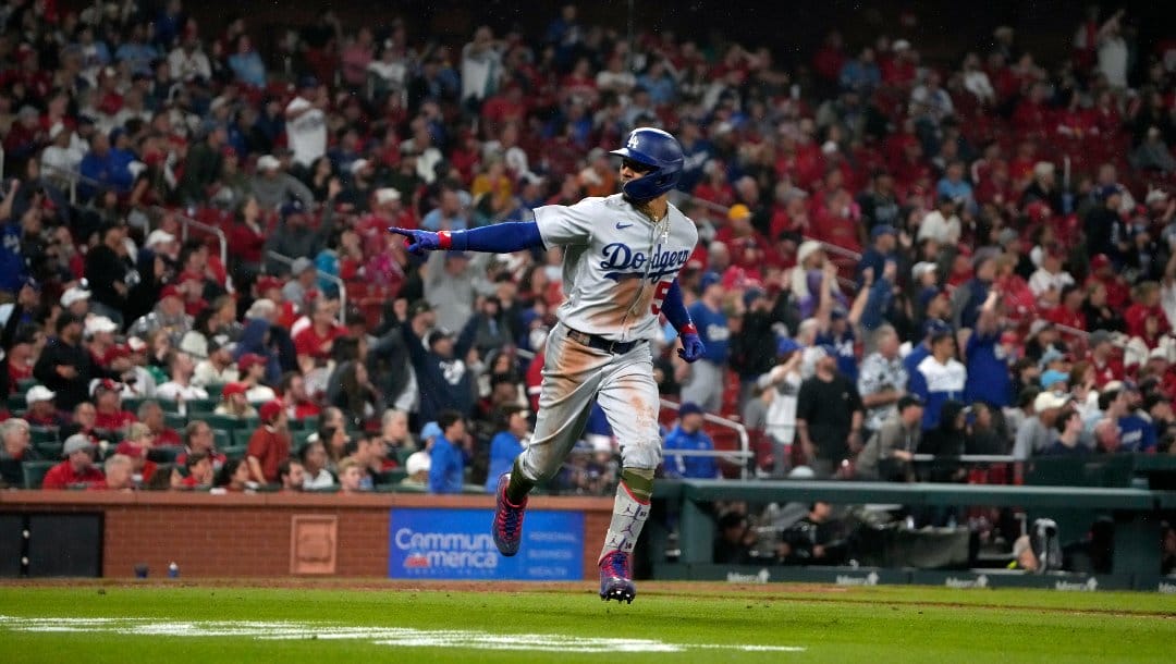 Los Angeles Dodgers' Mookie Betts celebrates after hitting a three-run home run during the eighth inning of a baseball game against the St. Louis Cardinals Friday, May 19, 2023, in St. Louis.