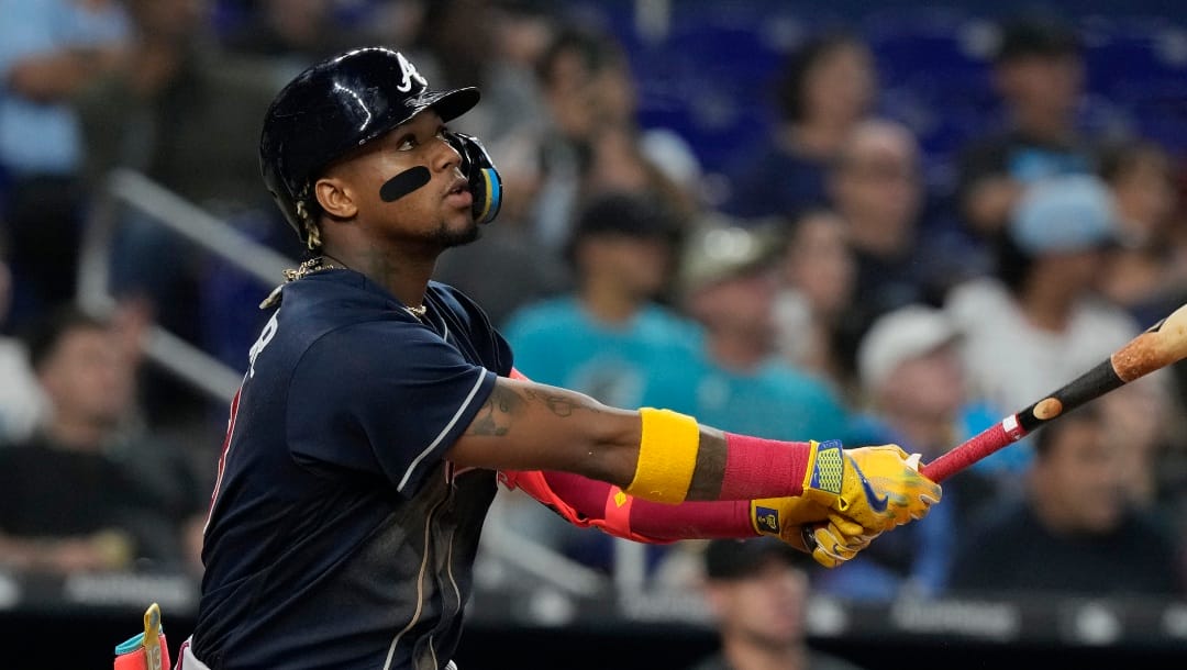 Atlanta Braves' Ronald Acuna Jr. (13) watches his hit during a baseball game against the Miami Marlins, Tuesday, May 2, 2023, in Miami. (AP Photo/Marta Lavandier)
