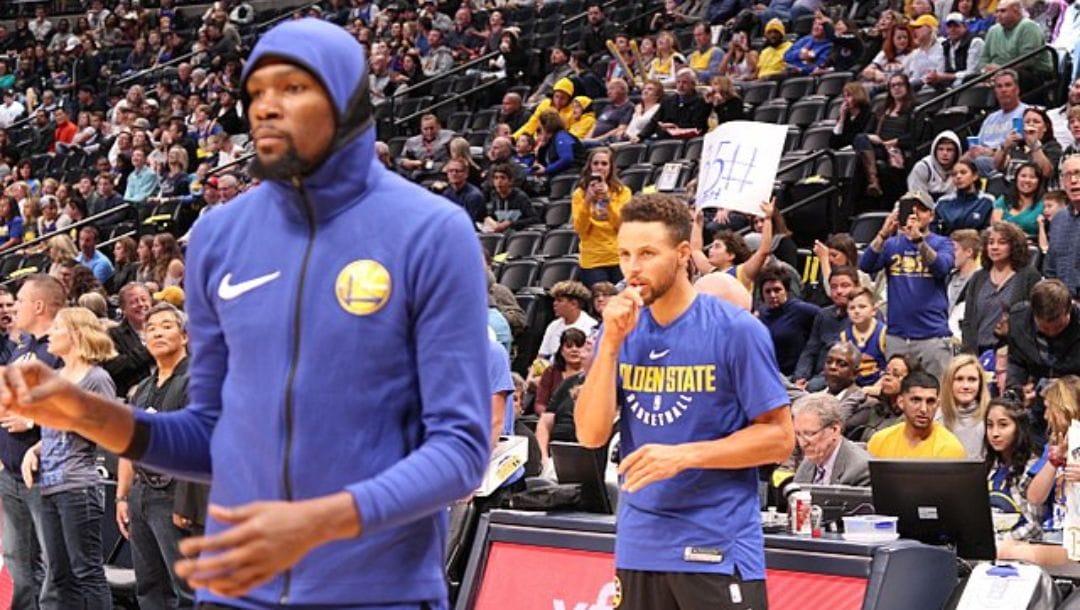 Stephen Curry and Kevin Durant practice prior to the start of a game in Denver, Colorado in November 2017.