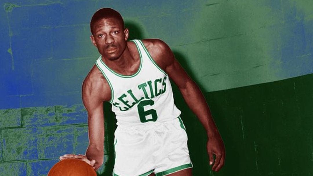 Former Boston Celtics player, Bill Russell dribbling the ball, during his first years with the franchise.
