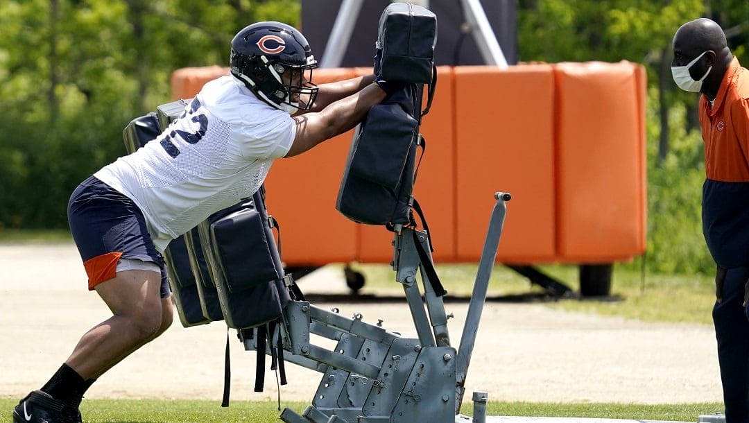 Chicago Bears defensive line Daniel Archibong works on the field during NFL football OTA practice in Lake Forest, Ill., Wednesday, June 2, 2021.