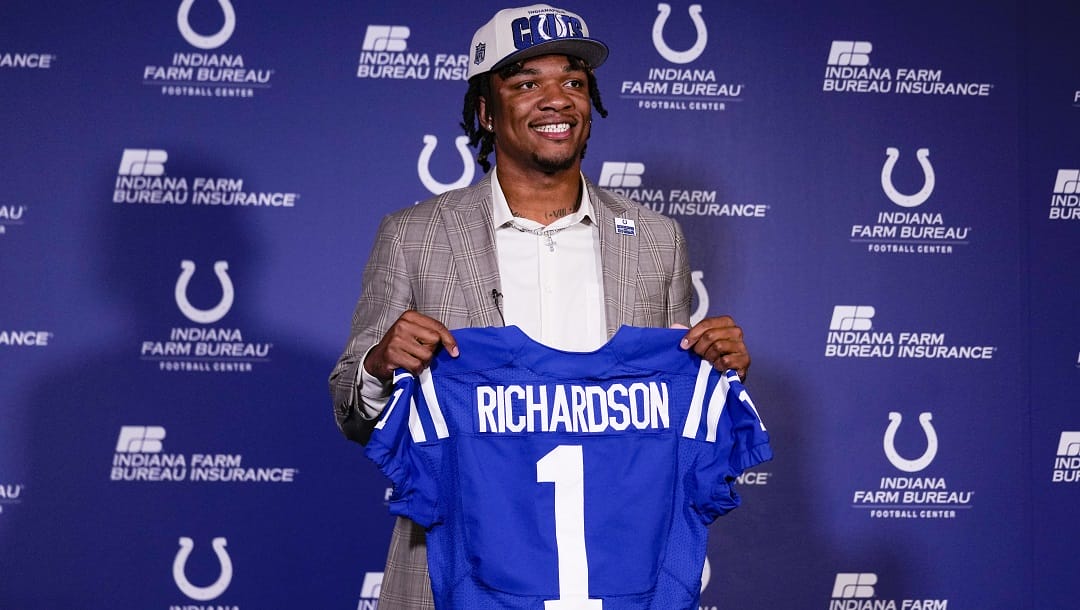 Indianapolis Colts first-round draft pick Anthony Richardson hold a Colts jersey following a news conference at the NFL football team's practice facility in Indianapolis, Friday, April 28, 2023.