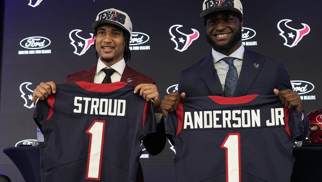 Houston Texans first round draft picks quarterback C.J. Stroud, left, and linebacker Will Anderson Jr. hold up jerseys during an introductory NFL football press conference, Friday, April 28, 2023, in Houston.