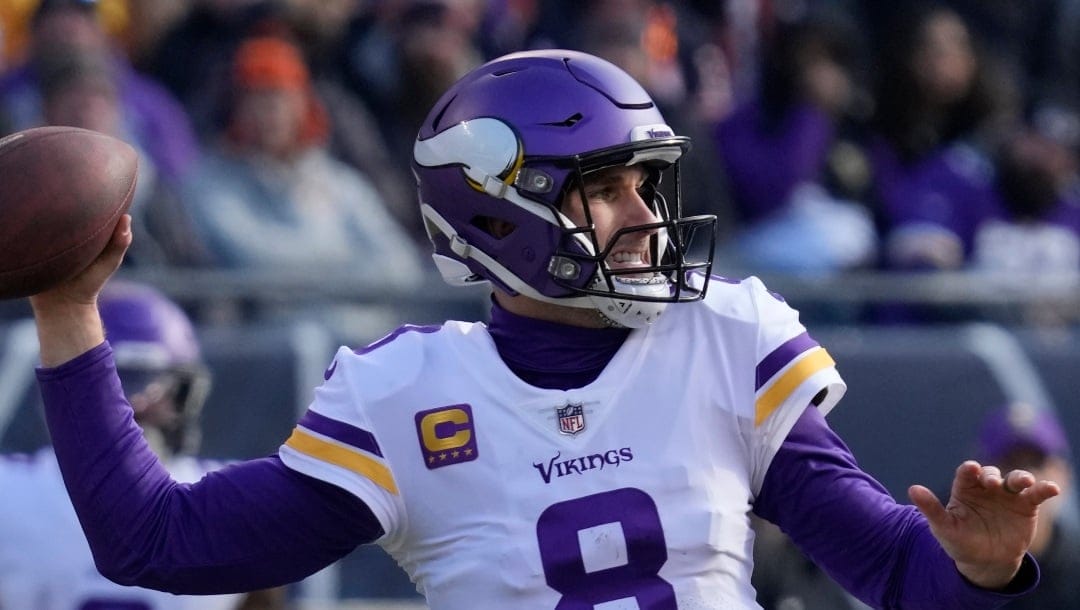 Minnesota Vikings quarterback Kirk Cousins throws a pass during the first half of an NFL football game against the Chicago Bears, Sunday, Jan. 8, 2023, in Chicago. (AP Photo/Nam Y. Huh)