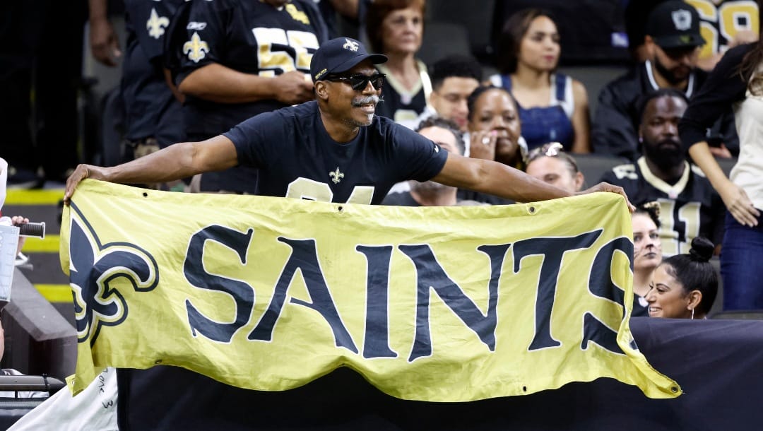 A New Orleans Saints fan cheers during the second half of an NFL football game between the New Orleans Saints and the Las Vegas Raiders Sunday, Oct. 30, 2022, in New Orleans. (AP Photo/Butch Dill)