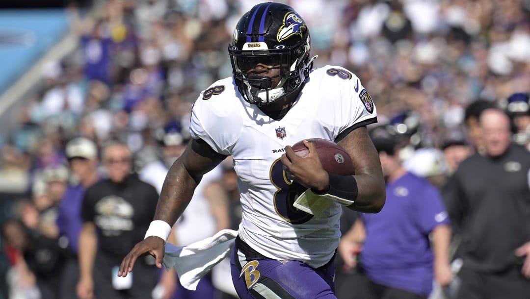 Baltimore Ravens quarterback Lamar Jackson (8) scrambles for yardage during the first half of an NFL football game the Jacksonville Jaguars, Sunday, Nov. 27, 2022, in Jacksonville, Fla. The Ravens agreed in principle with Jackson on a five-year deal Thursday, April 27, 2023, securing their star quarterback for the foreseeable future and ending a contract negotiation saga that was dominating the team's offseason.
