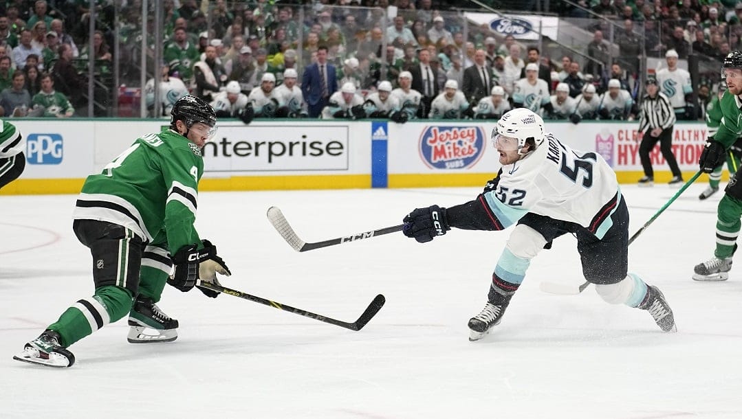 Seattle Kraken left wing Tye Kartye (52) scores as Dallas Stars' Miro Heiskanen (4) defend in the second period of Game 2 of an NHL hockey Stanley Cup second-round playoff series, Thursday, May 4, 2023, in Dallas.