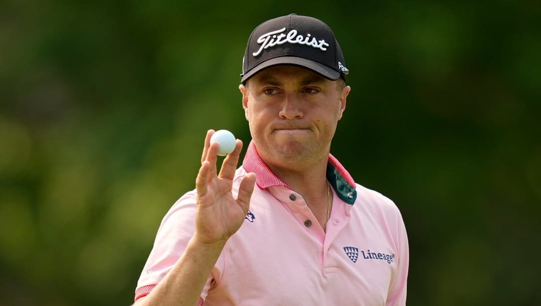Justin Thomas waves after making a putt on the 14th hole during the final round of the PGA Championship golf tournament at Southern Hills Country Club, Sunday, May 22, 2022, in Tulsa, Okla. (AP Photo/Eric Gay)