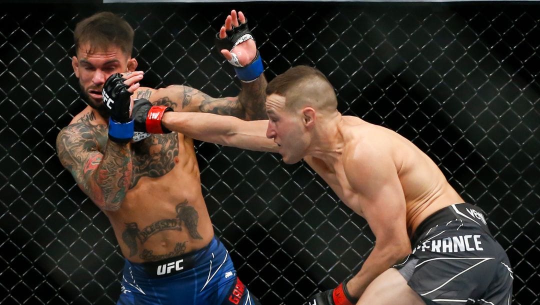Kai Kara-France, right, lands a punch against Cody Garbrandt during a flyweight mixed martial arts bout at UFC 269.