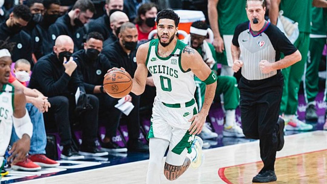 Jayson Tatum of the Boston Celtics sees action on the court against the Washington Wizards in their game in January 2022.