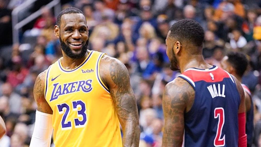 LeBron James of the Los Angeles Lakers interacts with Washington Wizards’s John Wall during an NBA game in December 2018.