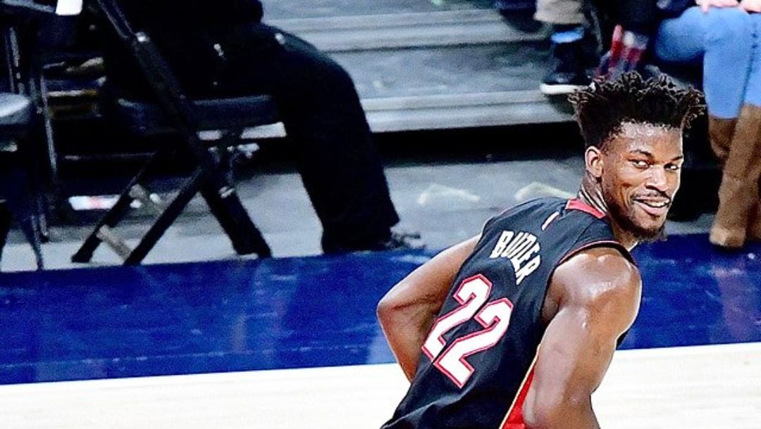 Jimmy Butler of the Miami Heat smirking while jogging during an NBA regular season game in March 2020.