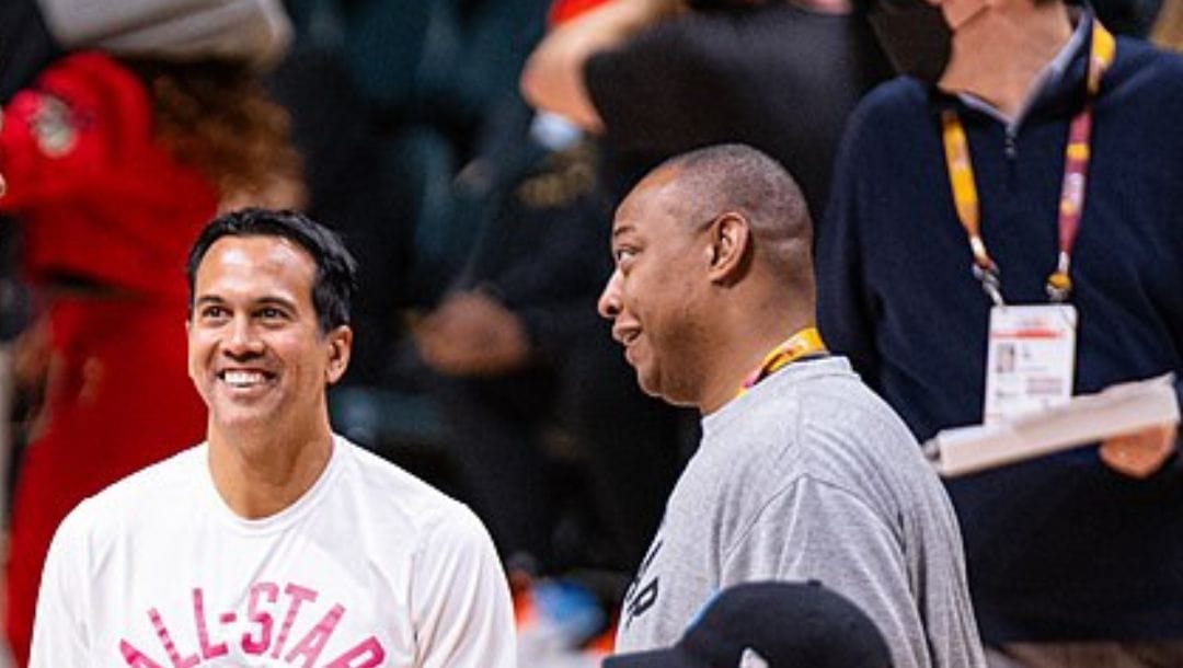 Miami Heat head coach Erik Spoelstra talks with his assistant coach Caron Butler during the 2022 NBA All-Star Weekend.