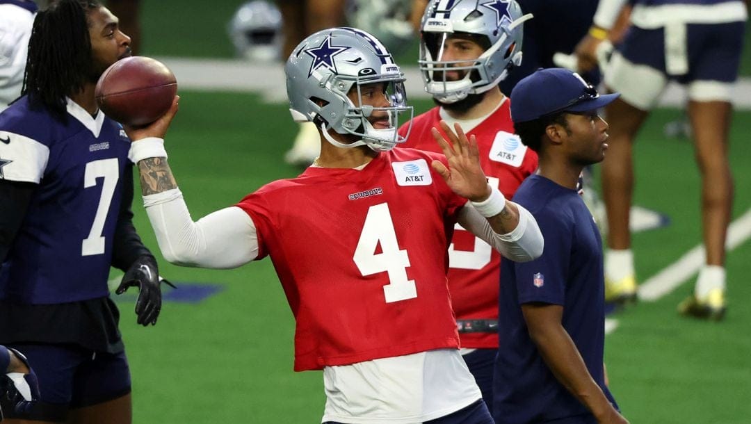 Dallas Cowboys quarterback Dak Prescott (4) throws a pass during an NFL football practice, Tuesday, June 6, 2023, in Frisco, Texas.