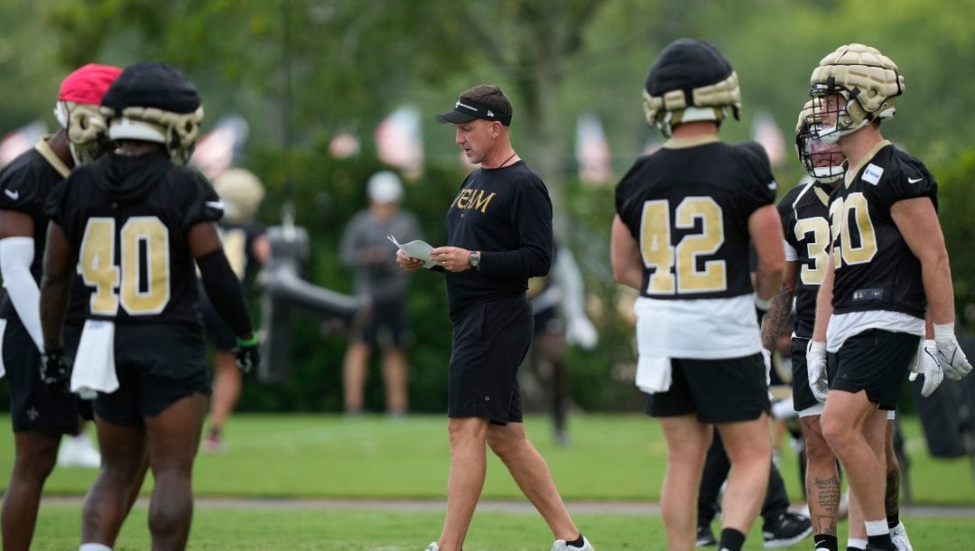 New Orleans Saints head coach Dennis Allen calls plays during an NFL football practice in Metairie, La., Tuesday, June 6, 2023.