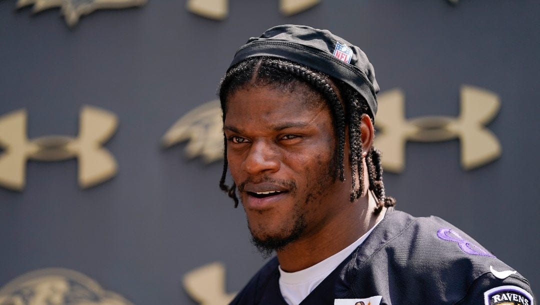 Baltimore Ravens quarterback Lamar Jackson walks after speaking to reporters following a workout at the team's NFL football practice, Wednesday, May 24, 2023, in Owings Mills.