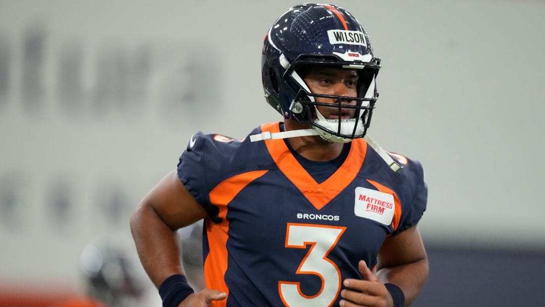Denver Broncos quarterback Russell Wilson (3) takes part in drills during a mandatory NFL football minicamp at the Broncos' headquarters Tuesday, June 13, 2023, in Centennial, Colo.