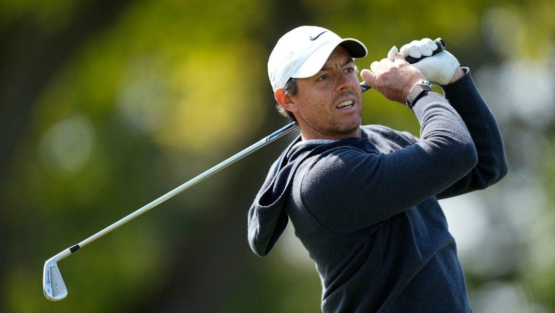 Rory McIlroy, of Northern Ireland, watches his tee shot on the 11th hole during the first round of the PGA Championship golf tournament at Oak Hill Country Club on Thursday, May 18, 2023, in Pittsford, N.Y.