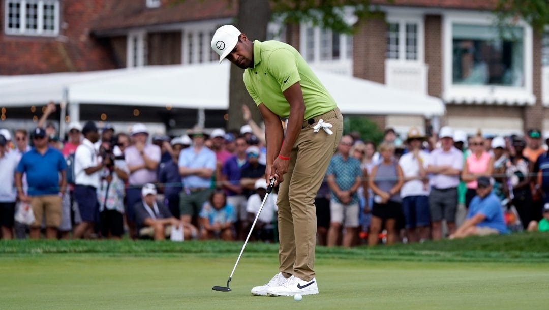 Tony Finau putts on the second green during the final round of the Rocket Mortgage Classic golf tournament, Sunday, July 31, 2022, in Detroit.