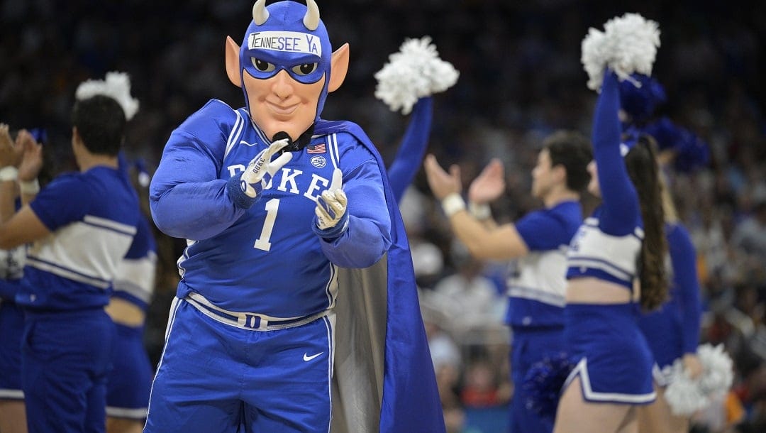 The Duke mascot and cheerleaders perform on the court during the second half of a second-round college basketball game against Tennessee in the NCAA Tournament, Saturday, March 18, 2023, in Orlando, Fla.