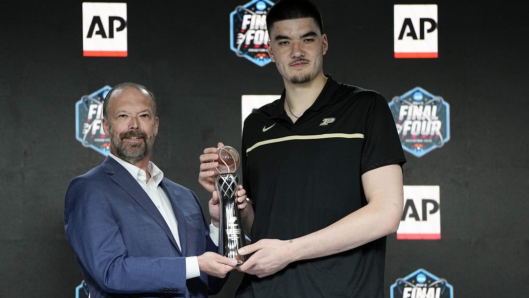 Marquette's Shaka Smart, left, and poses with Purdue's Zach Edey at a press conference after both were introduced as the AP Coach of the Year and AP Player of the Year during the Final Four NCAA college basketball tournament on Saturday, April 1, 2023, in Houston.