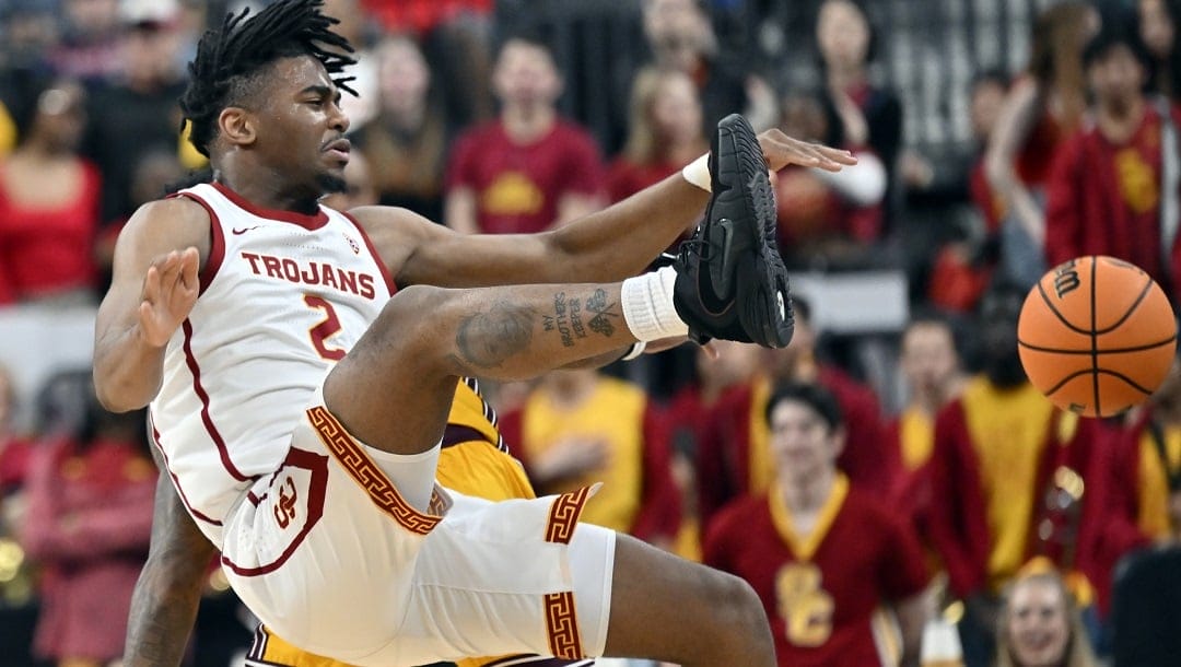 Southern California guard Reese Dixon-Waters (2) loses the ball after being fouled during the first half of the team's NCAA college basketball game against Southern California in the quarterfinals of the Pac-12 men's tournament Thursday, March 9, 2023, in Las Vegas.