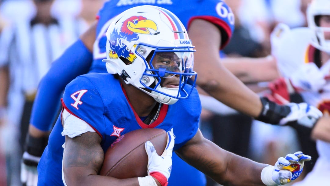 Kansas running back Devin Neal (4) carries against Iowa State during the second half of an NCAA college football game Saturday, Oct. 1, 2022, in Lawrence, Kan. (AP Photo/Reed Hoffmann)