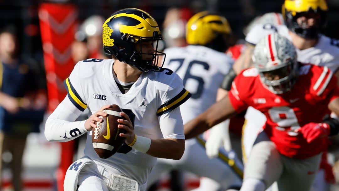 Michigan quarterback J.J. McCarthy drops back to pass against Ohio State during the first half of an NCAA college football game on Saturday, Nov. 26, 2022, in Columbus, Ohio. (AP Photo/Jay LaPrete)