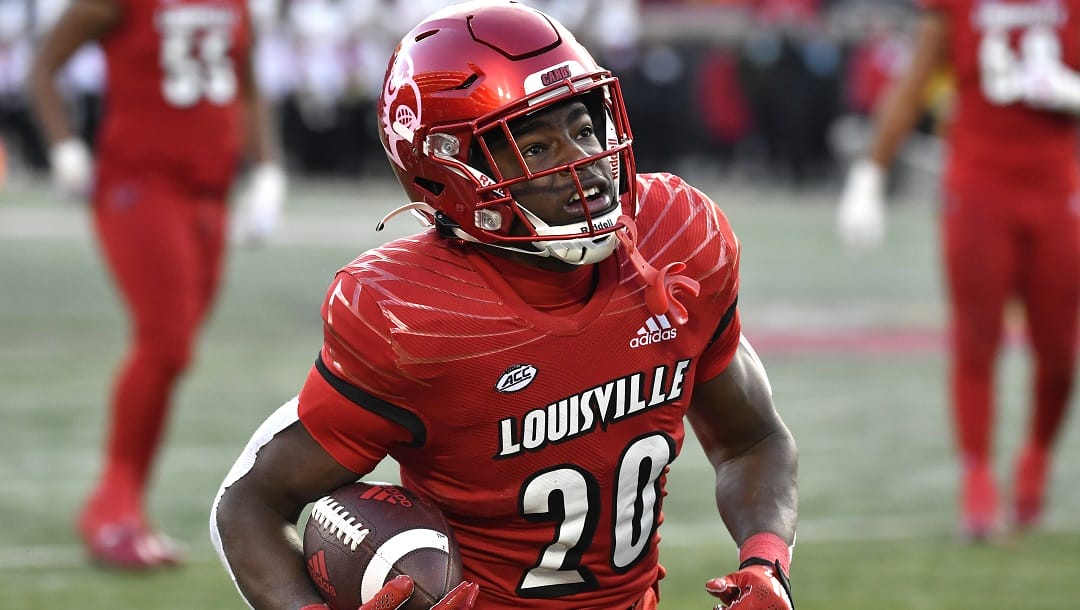 Louisville running back Maurice Turner (20) advances the ball during the first half of an NCAA college football game against North Carolina State in Louisville, Ky., Saturday, Nov. 19, 2022.