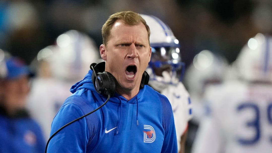 Southern Methodist head coach Rhett Lashlee yells to his team to get off the field after a scuffle during the second half of an NCAA college football game against Tulane in New Orleans, Thursday, Nov. 17, 2022. Tulane won 59-24. (AP Photo/Gerald Herbert)