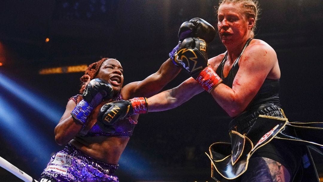Franchon Crews-Dezurn, left, punches Sweden's Elin Cederroos during the 10th round of a super middleweight championship.