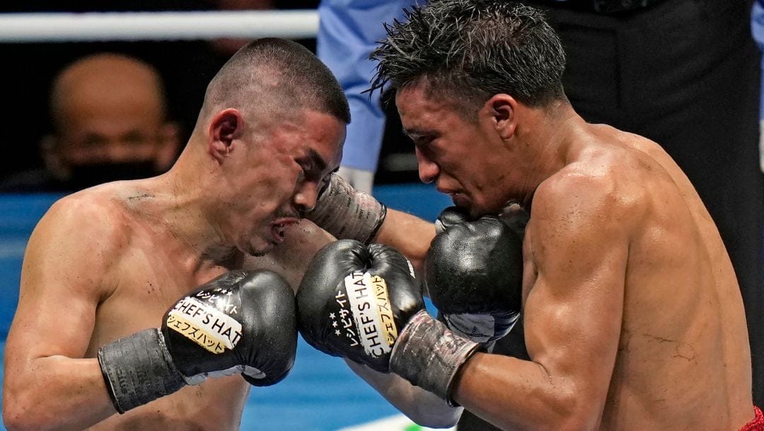 Kazuto Ioka, left, of Japan and Joshua Franco, right, of the U.S. fight in their WBO, WBA super flyweight world boxing title.