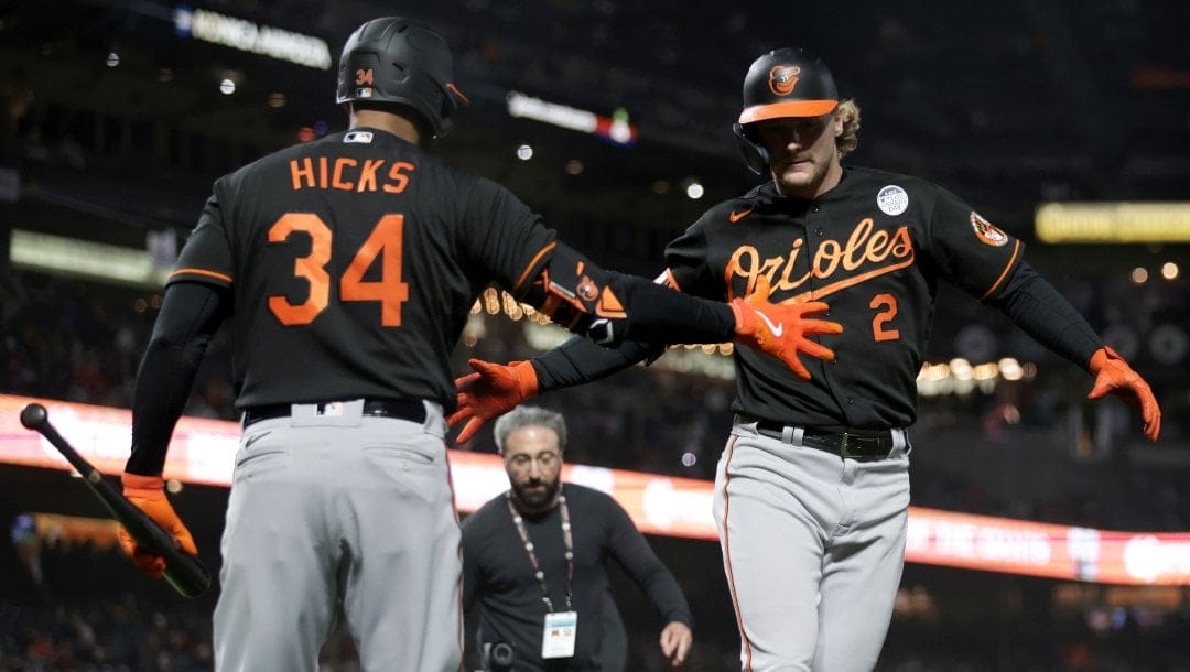 Baltimore Orioles' Gunnar Henderson (2) is congratulated by Aaron Hicks (34) after hitting a home run during the seventh inning of the team's baseball game against the San Francisco Giants in San Francisco, Friday, June 2, 2023.