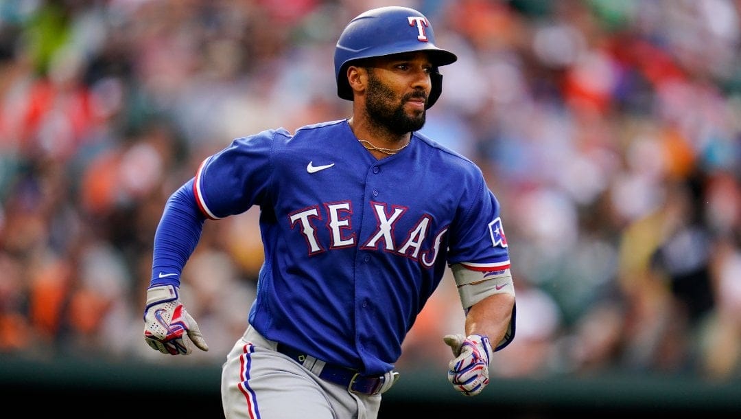 Texas Rangers' Marcus Semien watches his single against the Baltimore Orioles during the ninth inning of a baseball game, Saturday, May 27, 2023, in Baltimore. The Rangers won 5-3.