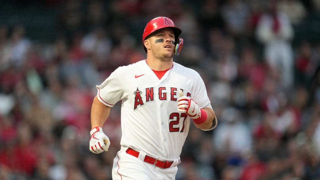 Los Angeles Angels' Mike Trout (27) runs to first base during a baseball game against the Boston Red Sox in Anaheim, Calif., Wednesday, May 24, 2023.