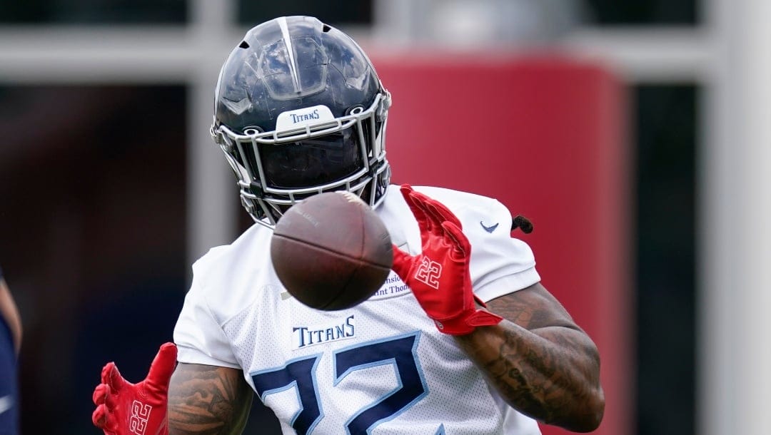 Tennessee Titans running back Derrick Henry (22) catches a ball during NFL football practice Wednesday, May 31, 2023, in Nashville, Tenn. (AP Photo/George Walker IV)