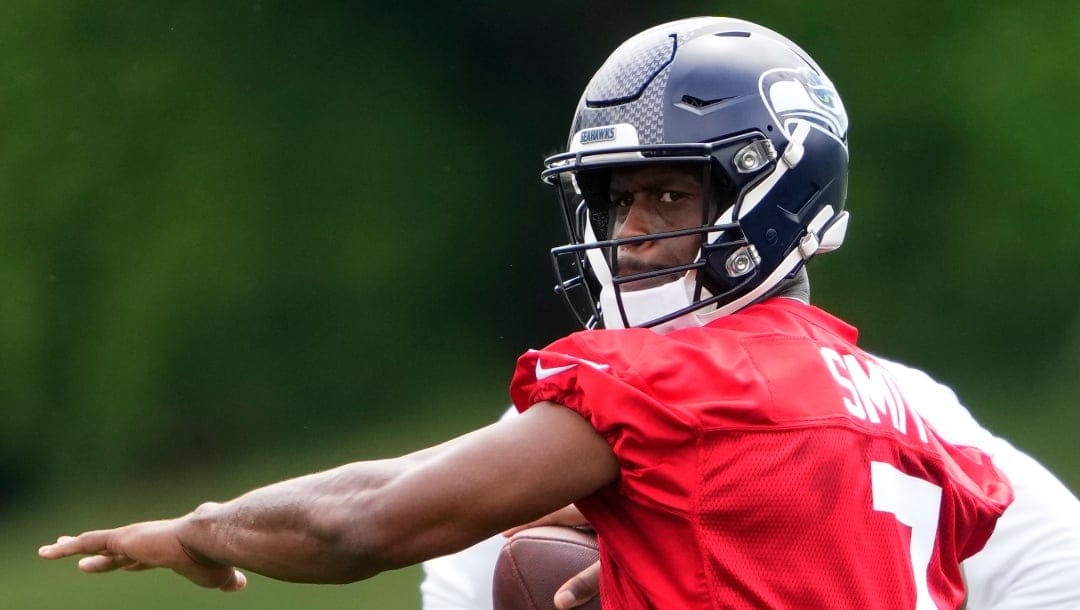 Seattle Seahawks quarterback Geno Smith prepares to throw during drills Monday, May 22, 2023, at the team's NFL football training facility in Renton, Wash. (AP Photo/Lindsey Wasson)