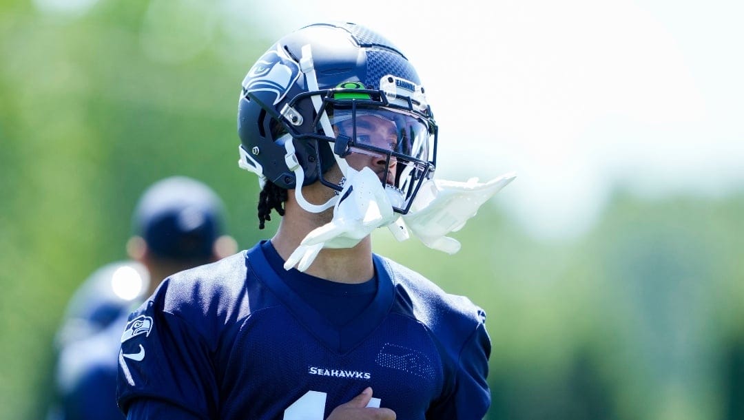 Seattle Seahawks wide receiver Jaxon Smith-Njigba (11) warms up on the field during the NFL football team's rookie minicamp, Friday, May 12, 2023, in Renton, Wash. (AP Photo/Lindsey Wasson)