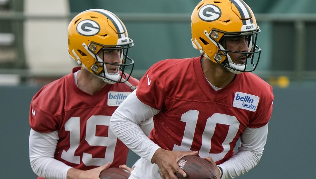 Green Bay Packers' Jordan Love 1nd Danny Etling drop back during an NFL football OTA practice session Wednesday, May 31, 2023, in Green Bay, Wis.